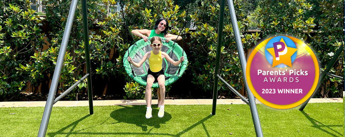 A mom pushing her daughter on the gobaplay Round Platform Swing.